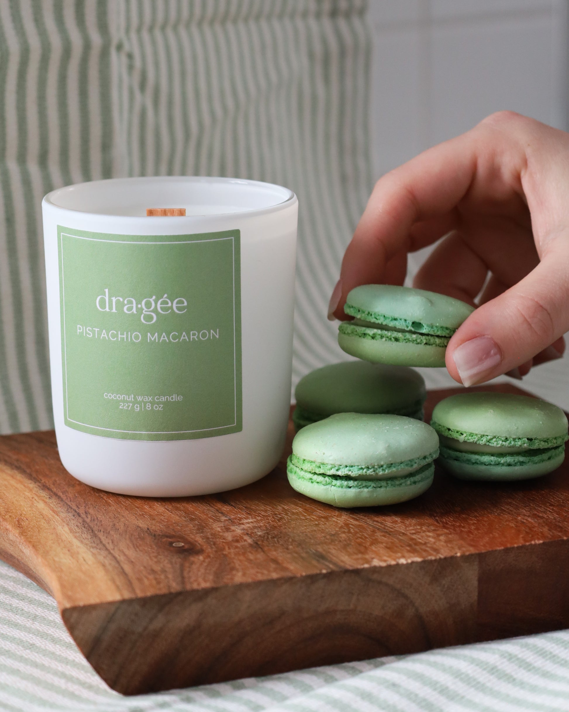 Pistachio Macaron coconut wax gourmand scented candle with wood wick in glass white matte jar by Dragée Candle Company.