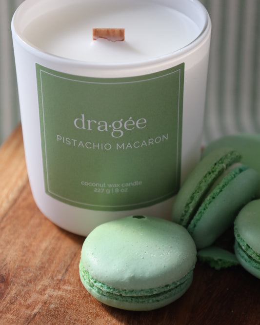 Pistachio Macaron coconut wax gourmand scented candle with wood wick in glass white matte jar by Dragée Candle Company.